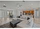 Spacious living room features stylish furniture, a ceiling fan, and a view into the modern kitchen at 4043 Salida Del Sol Dr, Sun City Center, FL 33573