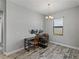 Bright office space with wood-look tile flooring and natural light from the window at 4043 Salida Del Sol Dr, Sun City Center, FL 33573