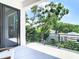 Enjoy outdoor living on this spacious balcony with sleek railings and scenic views of lush greenery at 4816 W San Jose St, Tampa, FL 33629
