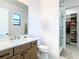 Modern bathroom features a glass-enclosed shower and closet space at 4816 W San Jose St, Tampa, FL 33629