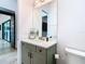Contemporary bathroom with a white countertop vanity and a large mirror at 4816 W San Jose St, Tampa, FL 33629