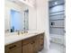 Bathroom features a modern vanity and tiled shower at 4816 W San Jose St, Tampa, FL 33629