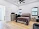 Comfortable bedroom with a ceiling fan, a cozy bed, and stylish decorations at 4816 W San Jose St, Tampa, FL 33629