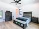 Bedroom features hardwood floors, neutral colors, natural light and a built-in shoe bench at 4816 W San Jose St, Tampa, FL 33629