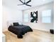 Modern bedroom with sleek furniture, minimalist decor, and wood flooring at 4816 W San Jose St, Tampa, FL 33629
