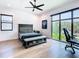 Bedroom features hardwood floors, natural light, neutral colors and an attached shoe bench at 4816 W San Jose St, Tampa, FL 33629