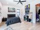 Stylish bedroom boasts light wood floors, modern decor and a walk-in closet at 4816 W San Jose St, Tampa, FL 33629