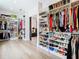 Large walk-in closet with custom shelving for clothes and shoes at 4816 W San Jose St, Tampa, FL 33629