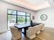 Chic dining area featuring a large window, stylish furnishings, and ample natural light, ideal for gatherings at 4816 W San Jose St, Tampa, FL 33629