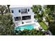 Aerial view of a modern home with a pool, putting green, and balconies at 4816 W San Jose St, Tampa, FL 33629