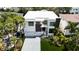 Stunning aerial view of a modern home, lush landscaping, and a spacious driveway at 4816 W San Jose St, Tampa, FL 33629