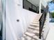 An outdoor shower sits at the base of the exterior staircase at 4816 W San Jose St, Tampa, FL 33629