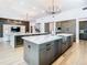 Gourmet kitchen with marble counters, stainless appliances, and large island with wine fridge, perfect for entertaining at 4816 W San Jose St, Tampa, FL 33629