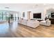Open concept living room featuring wood floors, modern furnishings, and sleek design at 4816 W San Jose St, Tampa, FL 33629