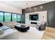 Modern living room features a decorative fireplace, modern lighting, and hardwood flooring at 4816 W San Jose St, Tampa, FL 33629