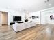 Bright and airy living room with wood floors and shiplap accent wall at 4816 W San Jose St, Tampa, FL 33629