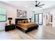 Bright main bedroom boasts wood floors, accent art, and natural light at 4816 W San Jose St, Tampa, FL 33629