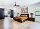 Spacious main bedroom with wood floors, black-out curtains, and ensuite closet at 4816 W San Jose St, Tampa, FL 33629