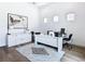 Bright home office featuring a modern white desk, a geometric rug, and stylish decorations at 4816 W San Jose St, Tampa, FL 33629