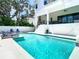 Gorgeous pool and outdoor living space with lounge chairs at 4816 W San Jose St, Tampa, FL 33629