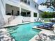 Lounge by the crystal-clear pool in this backyard oasis, featuring sun loungers, and a spa at 4816 W San Jose St, Tampa, FL 33629