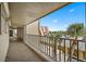 Balcony overlooking parking area and nearby resort, featuring an open-air design at 5000 Gulf Blvd # 304, St Pete Beach, FL 33706