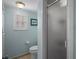 Bathroom featuring white fixtures and a shower with textured glass door at 5000 Gulf Blvd # 304, St Pete Beach, FL 33706