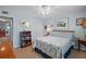 Cozy bedroom featuring a view to the water and a ceiling fan at 5000 Gulf Blvd # 304, St Pete Beach, FL 33706