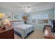 Comfortable bedroom with a queen bed, shuttered windows, and carpeted flooring at 5000 Gulf Blvd # 304, St Pete Beach, FL 33706
