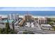 High-rise building overlooks a beach with tennis courts, a private pool, and on-site parking at 5000 Gulf Blvd # 304, St Pete Beach, FL 33706