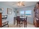 Dining room with a view of the ocean and a wooden table at 5000 Gulf Blvd # 304, St Pete Beach, FL 33706
