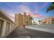 Beautiful condo exterior featuring manicured grounds, palm trees and garage spaces, perfect for coastal living at 5000 Gulf Blvd # 304, St Pete Beach, FL 33706