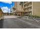 Exterior building with covered entry, landscaping and convenient parking area at 5000 Gulf Blvd # 304, St Pete Beach, FL 33706