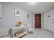 Hallway with tiled floor, stylish decor and a beautiful wood door at 5000 Gulf Blvd # 304, St Pete Beach, FL 33706