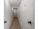 Hallway view with white doors and lighting at 5000 Gulf Blvd # 304, St Pete Beach, FL 33706