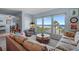 Relaxing living area with a view of the beach, complemented by tasteful decor at 5000 Gulf Blvd # 304, St Pete Beach, FL 33706