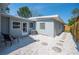 A charming backyard featuring gravel, stone pavers, new privacy fence, and a cozy seating area at 5050 Emerson S Ave, St Petersburg, FL 33707