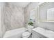 Bathroom featuring stylish tile, a bathtub, and a vanity with art displayed on the wall at 5050 Emerson S Ave, St Petersburg, FL 33707