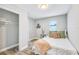 Comfortable bedroom featuring wood-look floors, neutral walls, and closet at 5050 Emerson S Ave, St Petersburg, FL 33707