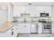 Well-equipped kitchen with stainless steel appliances, granite countertops, and updated fixtures at 5050 Emerson S Ave, St Petersburg, FL 33707