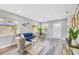 Bright living room with stylish furniture, modern decor, and ample natural light from large windows at 5050 Emerson S Ave, St Petersburg, FL 33707
