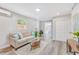 Cozy living room showcasing wood-look floors, neutral walls, and a comfortable sofa at 5050 Emerson S Ave, St Petersburg, FL 33707