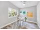 Modern office space featuring wood-look floors, neutral walls, and natural light at 5050 Emerson S Ave, St Petersburg, FL 33707