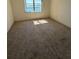 Bedroom featuring neutral paint and carpet with bay views at 5108 Brittany S Dr # 903, St Petersburg, FL 33715