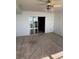 Bedroom with a large sliding glass door, carpeted floor and fan at 5108 Brittany S Dr # 903, St Petersburg, FL 33715