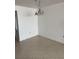 Empty dining room with tile floors and basic lighting at 5108 Brittany S Dr # 903, St Petersburg, FL 33715