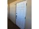 Condo doorway, unit 903, with white door at 5108 Brittany S Dr # 903, St Petersburg, FL 33715
