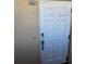 Condo doorway, unit 903, white door, with handle and locks at 5108 Brittany S Dr # 903, St Petersburg, FL 33715