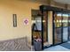 Entrance showcasing building address, fire safety sign, and automatic door at 5108 Brittany S Dr # 903, St Petersburg, FL 33715