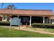 Professional building featuring a low-pitched terracotta roof, white support columns and an expansive tinted glass front at 5108 Brittany S Dr # 903, St Petersburg, FL 33715